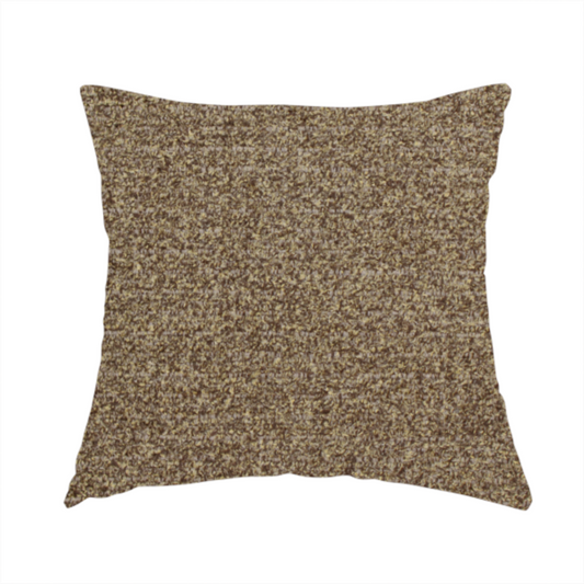 The fabric used to create this handmade cushion is a multi-toned golden brown, textured upholstery fabric.