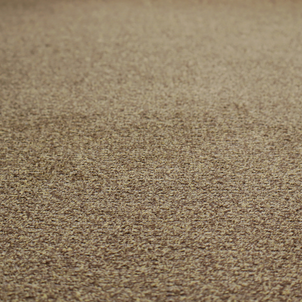 A multi-toned golden brown, textured upholstery fabric.