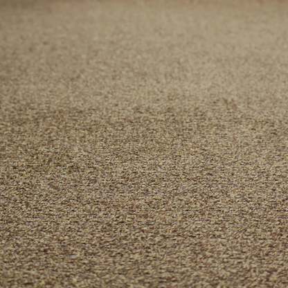 A multi-toned golden brown, textured upholstery fabric.