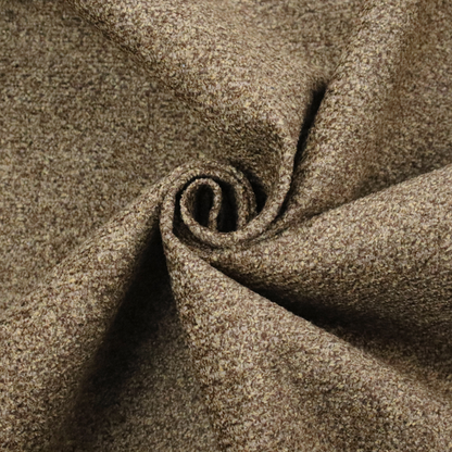 A multi-toned golden brown, textured upholstery fabric.