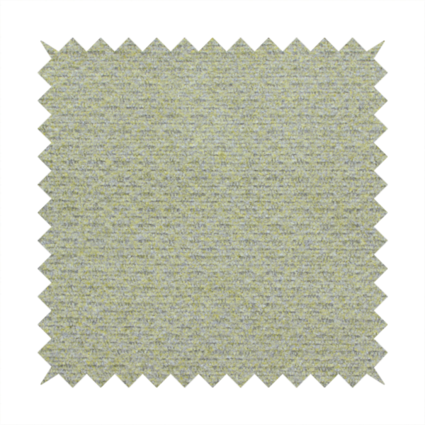 A multi-toned chartreuse green and grey textured upholstery fabric.