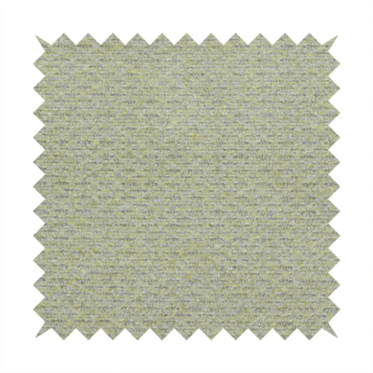 A multi-toned chartreuse green and grey textured upholstery fabric.