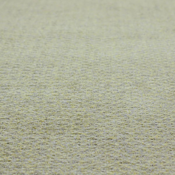 A multi-toned chartreuse green and grey textured upholstery fabric.