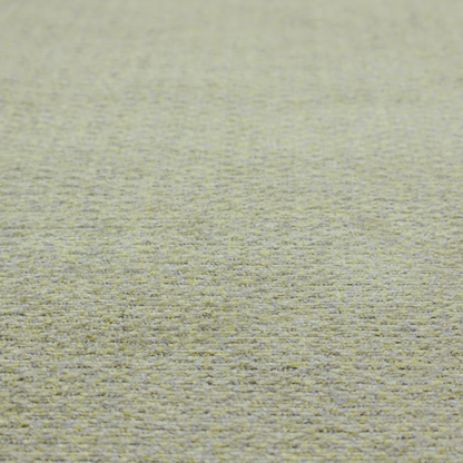 A multi-toned chartreuse green and grey textured upholstery fabric.
