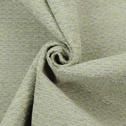 A multi-toned chartreuse green and grey textured upholstery fabric.