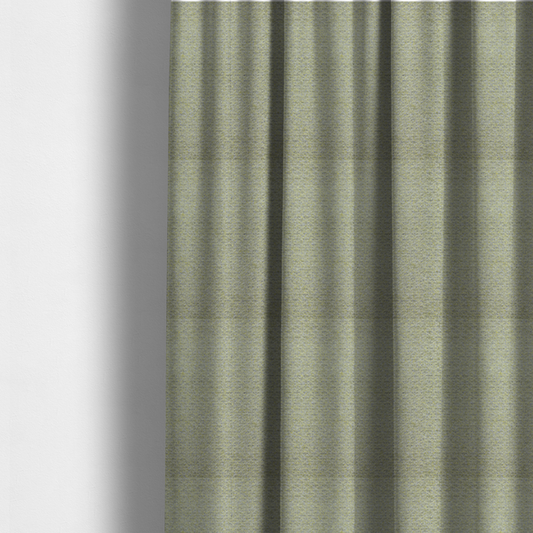 The fabric used to create these made-to-measure curtains is a multi-toned chartreuse green and grey textured upholstery fabric.
