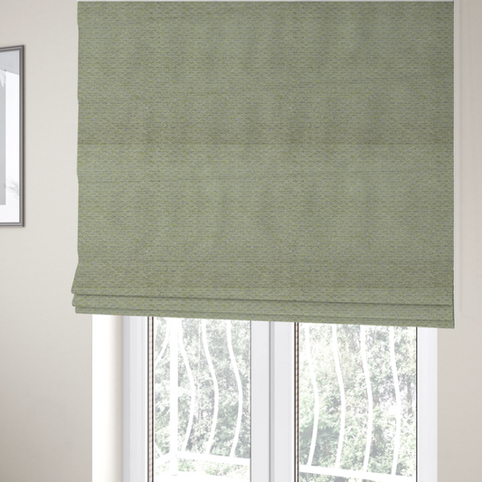 The fabric used to create these Roman blinds is a multi-toned chartreuse green and grey textured upholstery fabric.