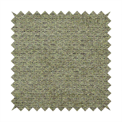 A multi-toned olive green textured upholstery fabric.