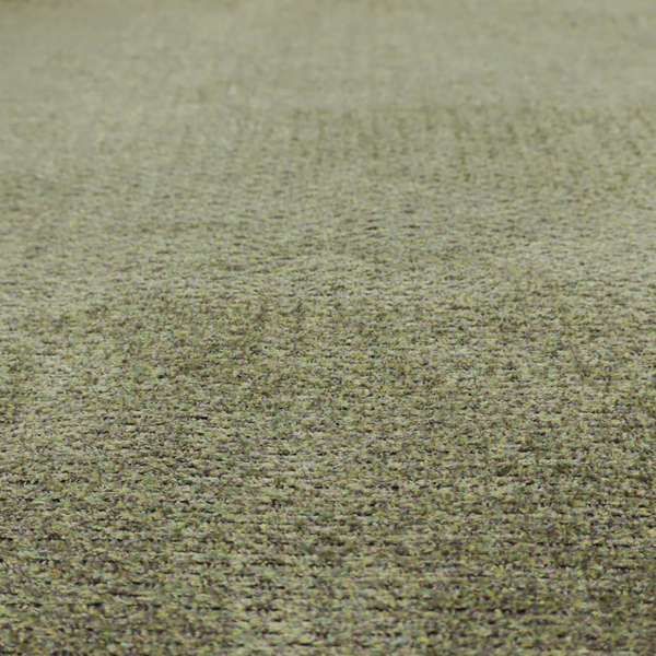 A multi-toned olive green textured upholstery fabric.