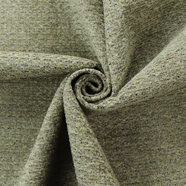 A multi-toned olive green textured upholstery fabric.