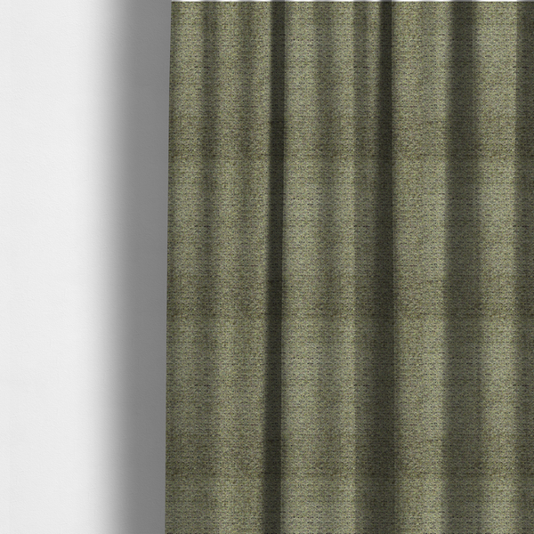 The fabric used to create these made-to-measure curtains is a multi-toned olive green textured upholstery fabric.