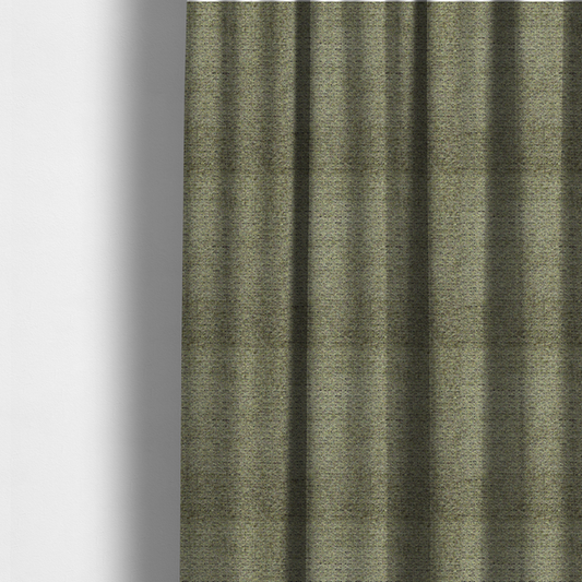 The fabric used to create these made-to-measure curtains is a multi-toned olive green textured upholstery fabric.