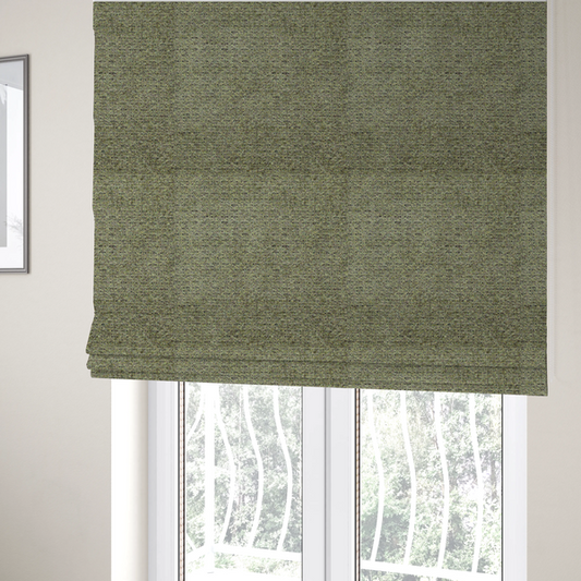 The fabric used to create these Roman blinds is a multi-toned olive green textured upholstery fabric.