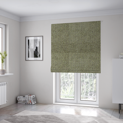 The fabric used to create these Roman blinds is a multi-toned olive green textured upholstery fabric.