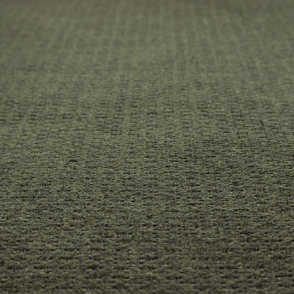 A dark forest green, heavily textured upholstery fabric.