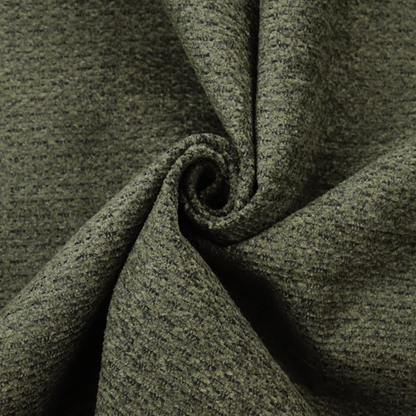 A dark forest green, heavily textured upholstery fabric.