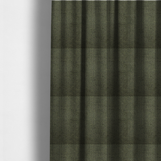 The fabric used to create these made-to-measure curtains is a dark forest green, heavily textured upholstery fabric.