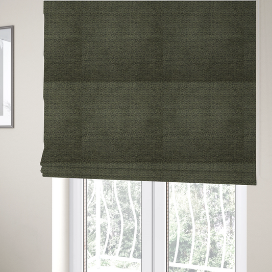 The fabric used to create these Roman blinds is a dark forest green, heavily textured upholstery fabric.