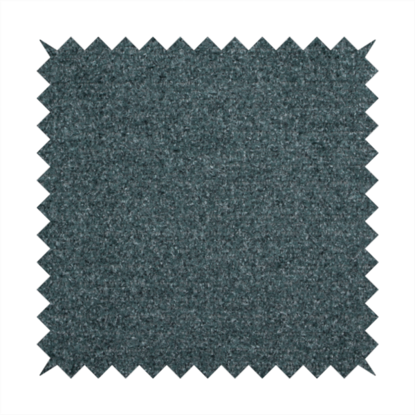 A dark teal or slate blue, textured upholstery fabric.