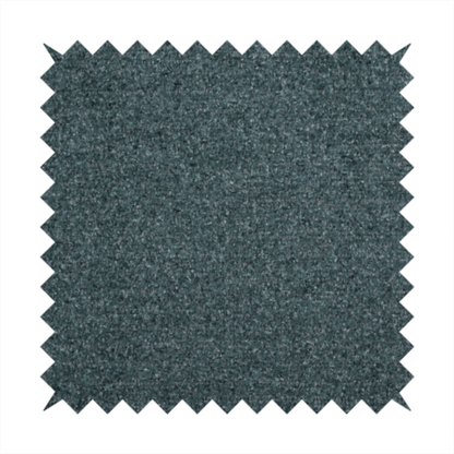 A dark teal or slate blue, textured upholstery fabric.