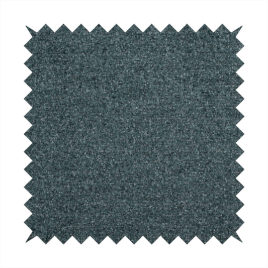 A dark teal or slate blue, textured upholstery fabric.