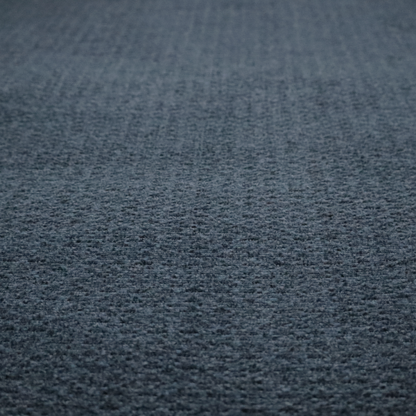 a dark navy blue, heavily textured upholstery fabric.