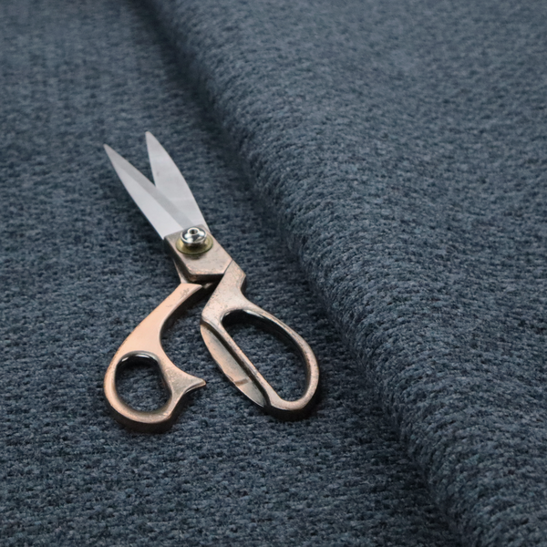 a dark navy blue, heavily textured upholstery fabric.