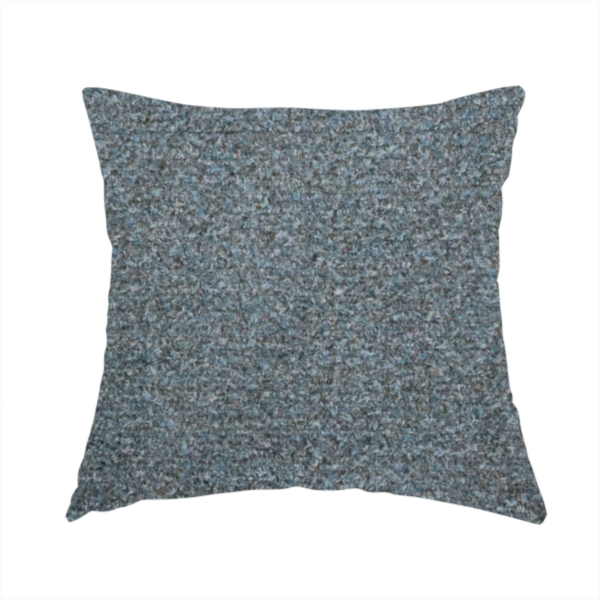 The fabric used to create this handmade cushion is a multi-toned steel blue and grey textured upholstery fabric.