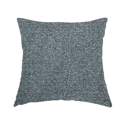 The fabric used to create this handmade cushion is a multi-toned steel blue and grey textured upholstery fabric.