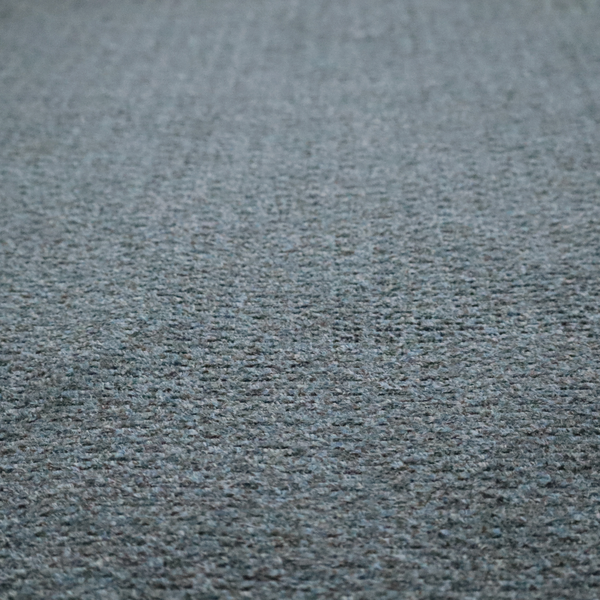 a multi-toned steel blue and grey textured upholstery fabric.