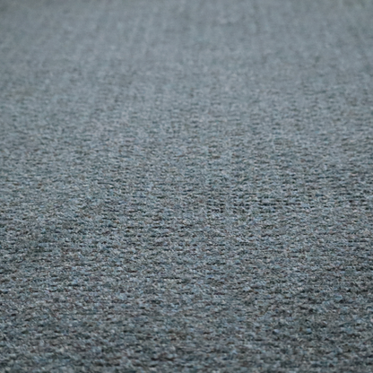 a multi-toned steel blue and grey textured upholstery fabric.
