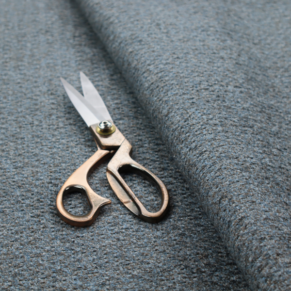a multi-toned steel blue and grey textured upholstery fabric.