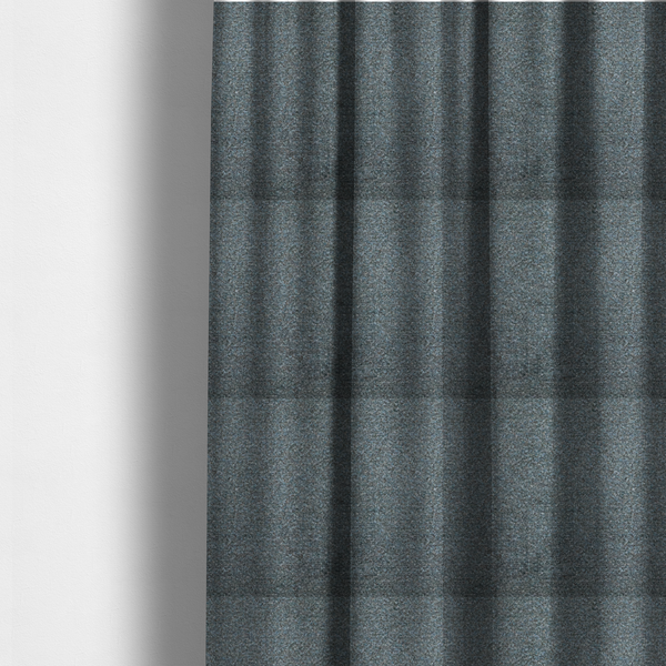 The fabric used to create these made-to-measure curtains is a multi-toned steel blue and grey textured upholstery fabric.