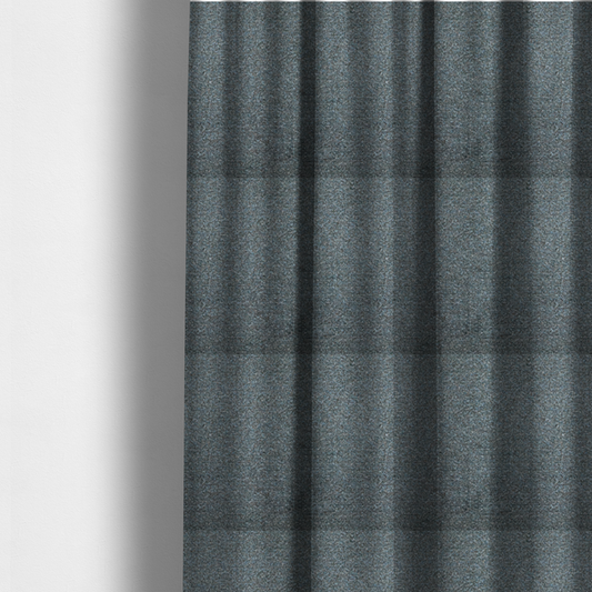 The fabric used to create these made-to-measure curtains is a multi-toned steel blue and grey textured upholstery fabric.