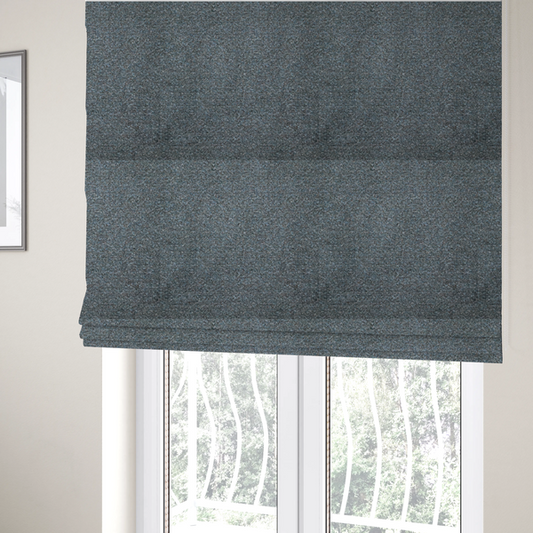 The fabric used to create these Roman blinds is a multi-toned steel blue and grey textured upholstery fabric.