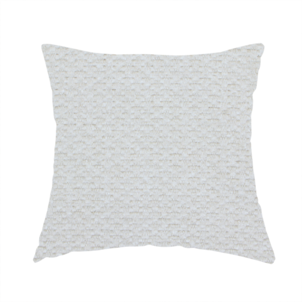 The fabric used to create this handmade cushion is a swatch of textured cream white upholstery fabric.