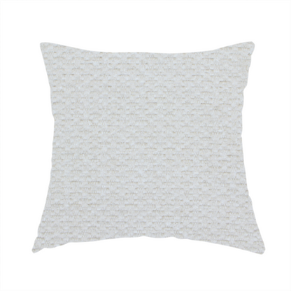 The fabric used to create this handmade cushion is a swatch of textured cream white upholstery fabric.