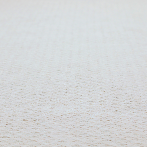 A swatch of textured cream white upholstery fabric.
