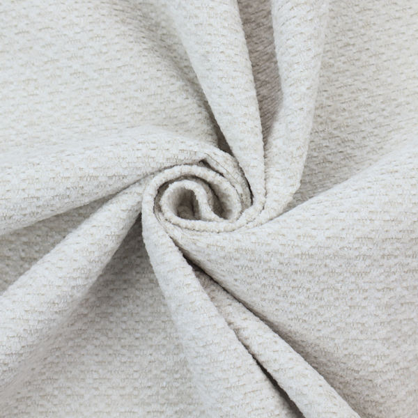 A swatch of textured cream white upholstery fabric.
