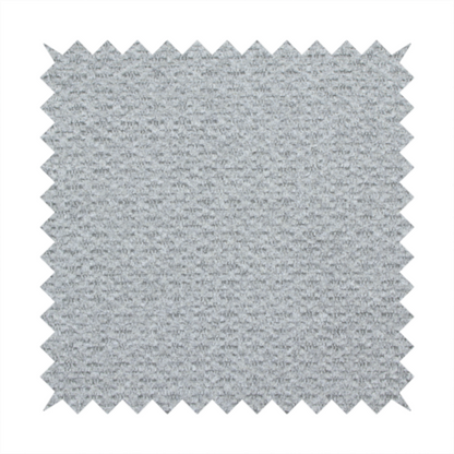 A textured light grey upholstery fabric.
