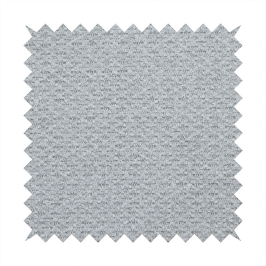 A textured light grey upholstery fabric.