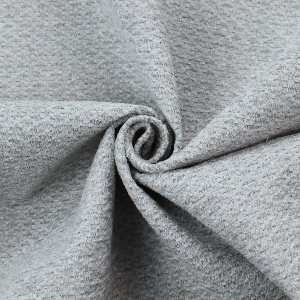 A textured light grey upholstery fabric.