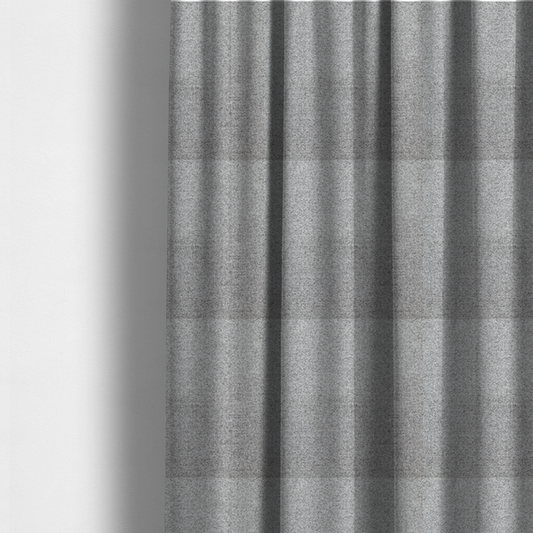 The fabric used to create these made-to-measure curtains is a  textured mid-grey upholstery fabric with a subtle heathered effect.