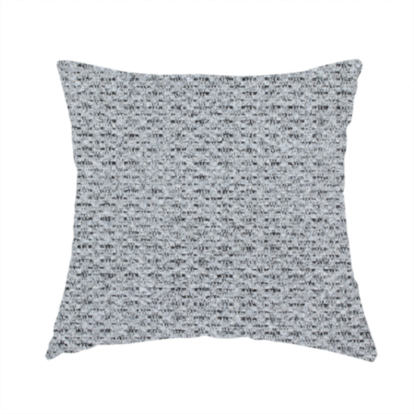 The fabric used to create this handmade cushion is a textured light charcoal grey upholstery fabric with distinct darker horizontal weave lines.