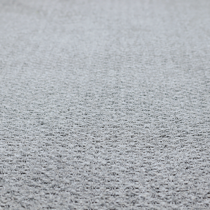 A textured light charcoal grey upholstery fabric with distinct darker horizontal weave lines.