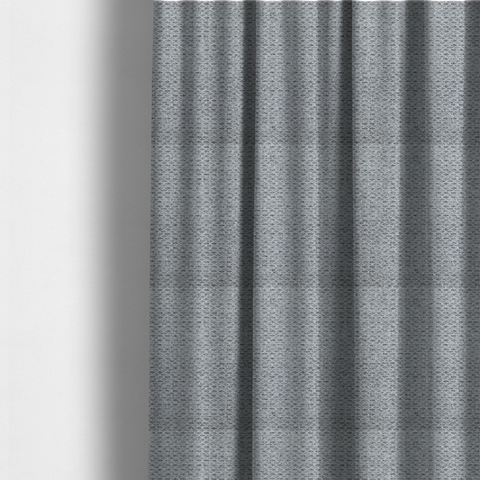The fabric used to create these made-to-measure curtains is a textured light charcoal grey upholstery fabric with distinct darker horizontal weave lines.