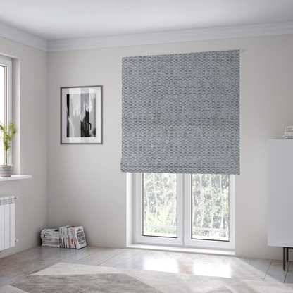 The fabric used to create these Roman blinds is a textured light charcoal grey upholstery fabric with distinct darker horizontal weave lines.