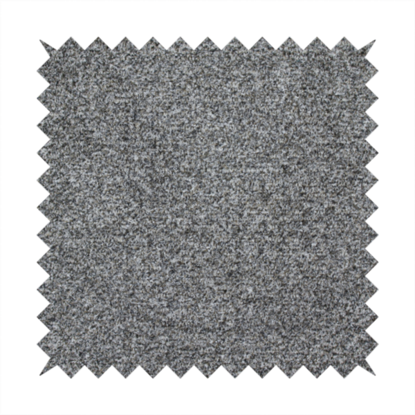 A multi-toned charcoal grey and silver textured upholstery fabric.