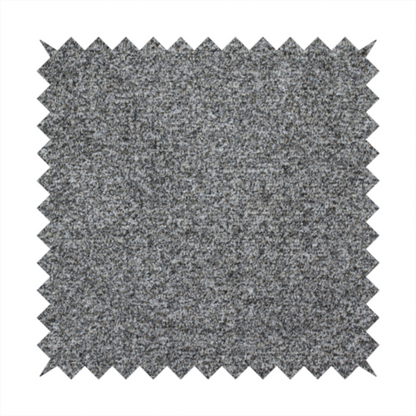 A multi-toned charcoal grey and silver textured upholstery fabric.