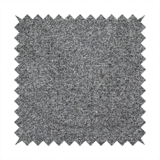 A multi-toned charcoal grey and silver textured upholstery fabric.